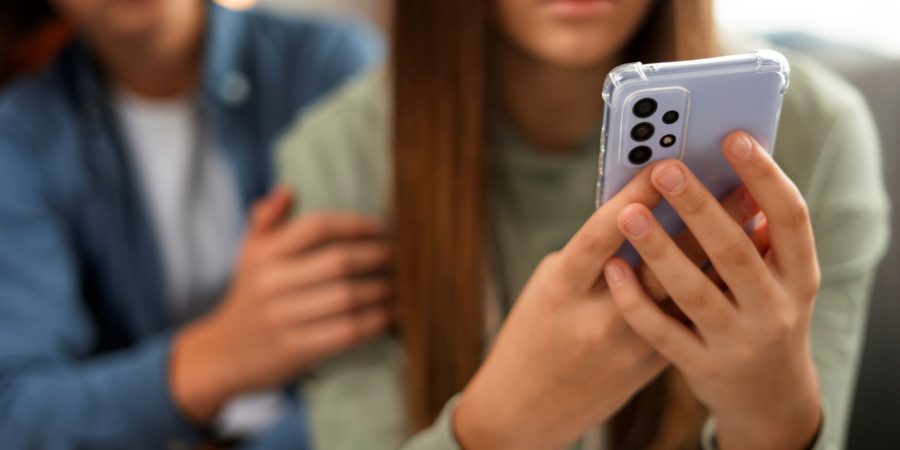 front-view-sad-teenager-being-cyberbullied